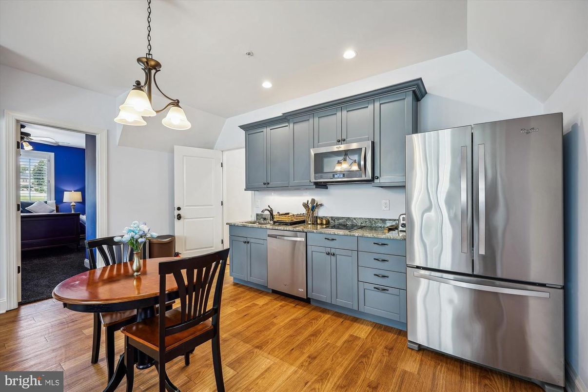 Dining room, Interior, Kitchen, Pendant Lights, Recessed Lighting, Stainless Steel Appliances, Wood Texture Flooring