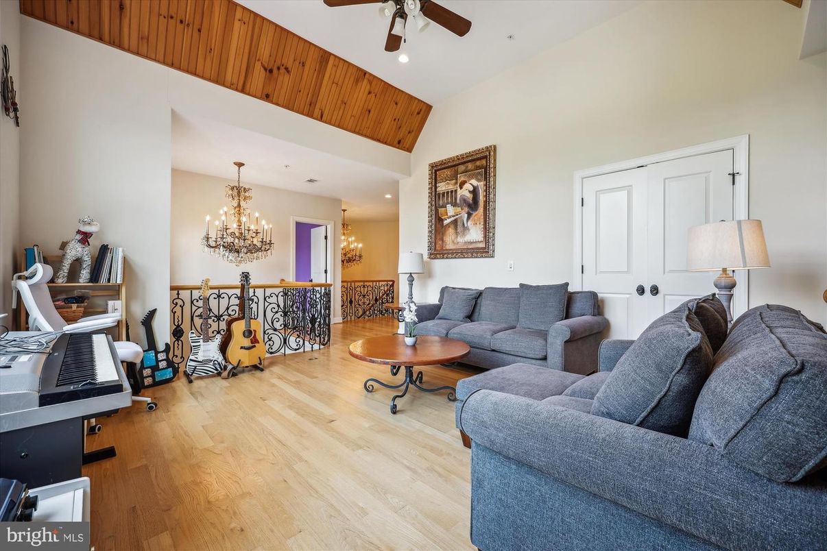 Chandelier, Dining room, Interior, Living room, Piano, Recessed Lighting, Wood Texture Flooring