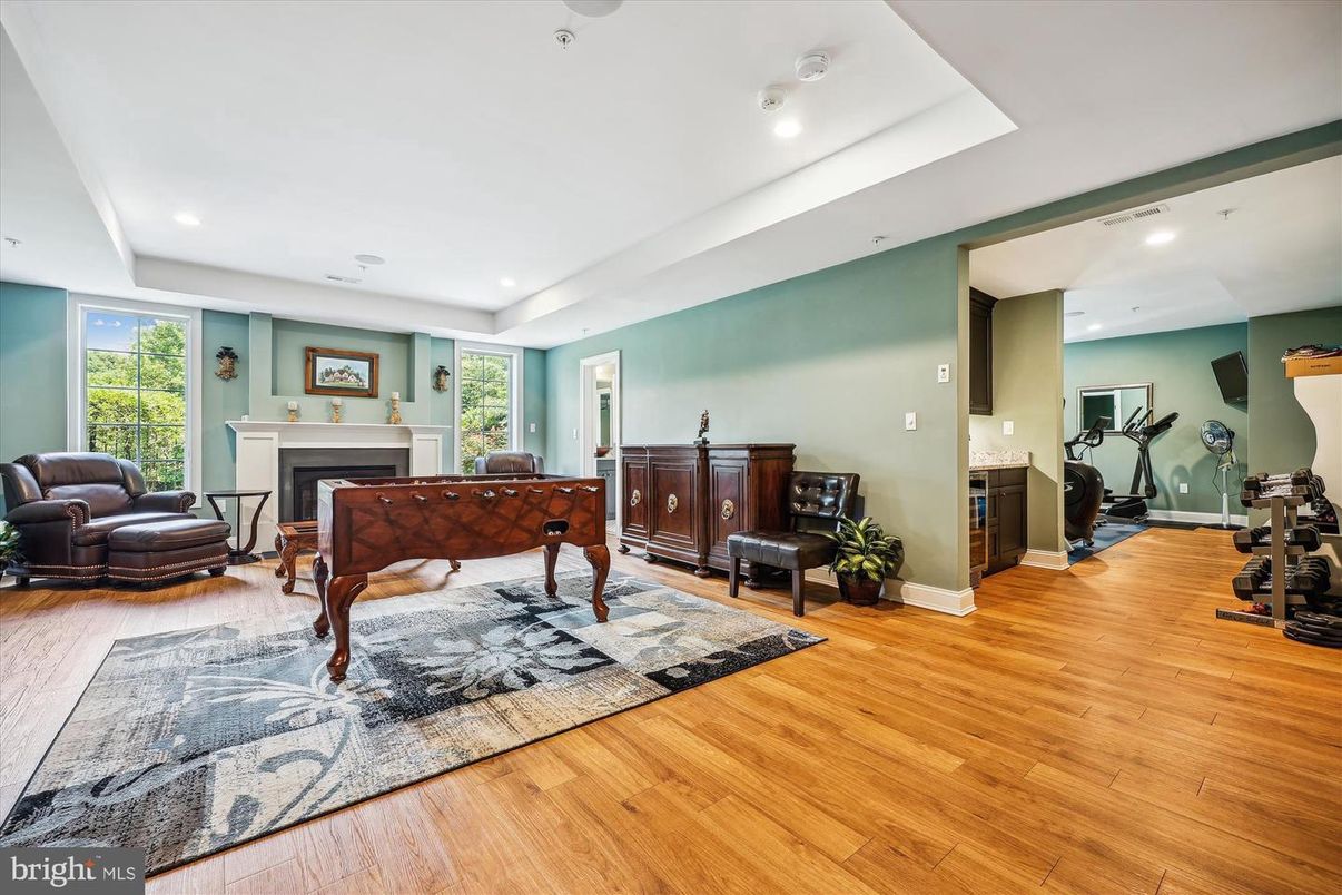 Fireplace, Fitness Equipment, Interior, Recessed Lighting, Wood Texture Flooring