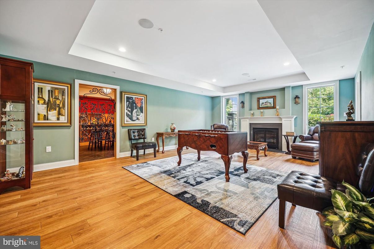 Fireplace, Game Room, Interior, Recessed Lighting, Wood Texture Flooring