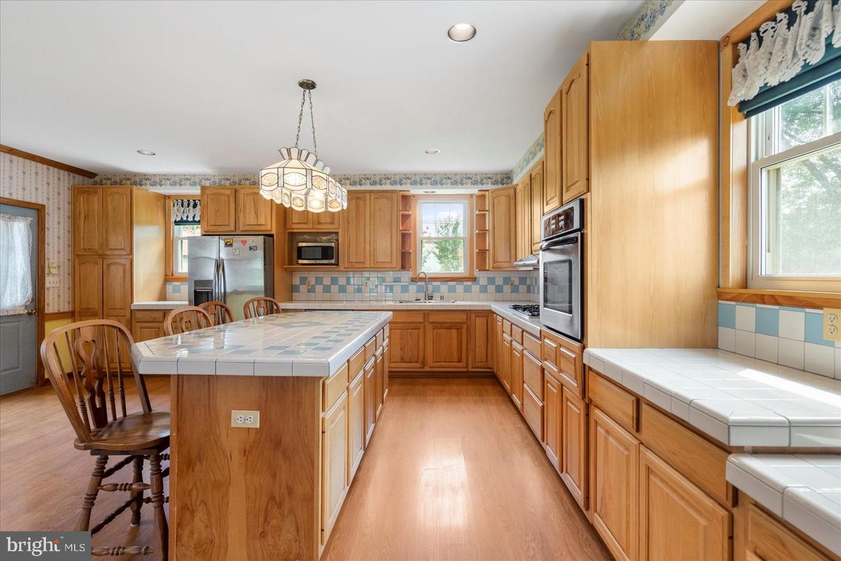 Interior, Kitchen, Pendant Lights, Recessed Lighting, Tile Countertops, Wood Texture Flooring