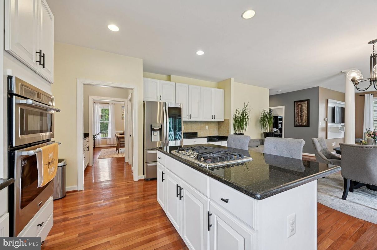 Chandelier, Dining room, Interior, Kitchen, Recessed Lighting, Stainless Steel Appliances, Wood Texture Flooring