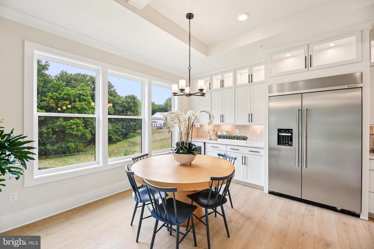 Chandelier, Dining room, Interior, Kitchen, Pendant Lights, Recessed Lighting, Stainless Steel Appliances, Wood Texture Flooring