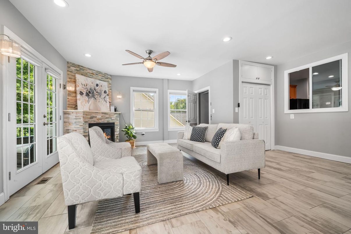 Fireplace, Interior, Living room, Recessed Lighting, Stone Walls, Wood Texture Flooring