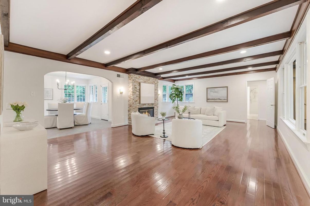 Chandelier, Dining room, Fireplace, Interior, Living room, Recessed Lighting, Stone Walls, Wooden Beams, Wood Texture Flooring