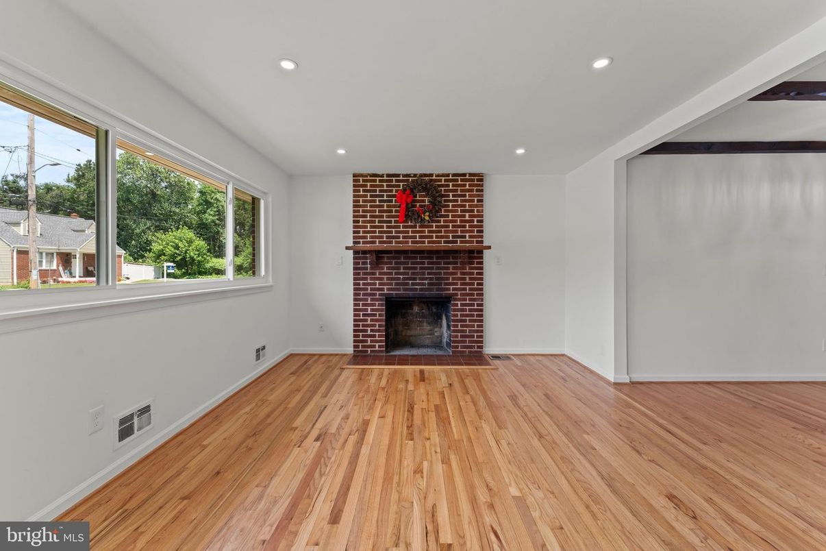 Empty room, Fireplace, Interior, Recessed Lighting, Stone Walls, Wood Texture Flooring