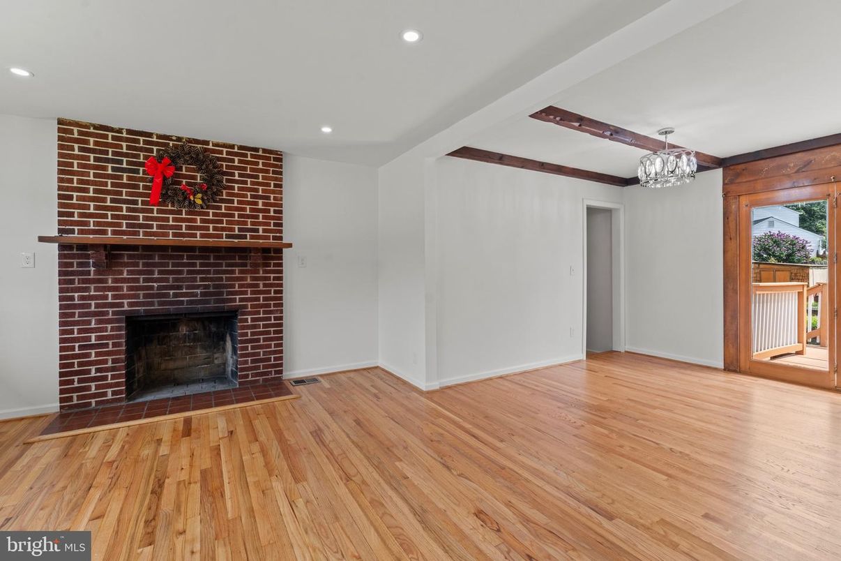 Chandelier, Empty room, Fireplace, Interior, Recessed Lighting, Stone Walls, Wooden Beams, Wood Texture Flooring