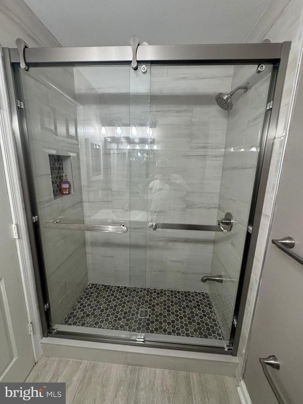 Bathroom, Glass Shower, Interior, Marble Walls, Wood Texture Flooring
