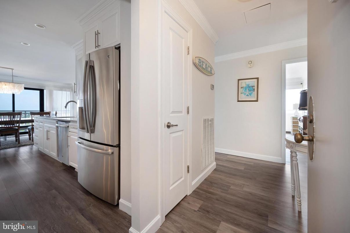 Chandelier, Dining room, Interior, Kitchen, Pendant Lights, Recessed Lighting, Stainless Steel Appliances, Water, Wood Texture Flooring