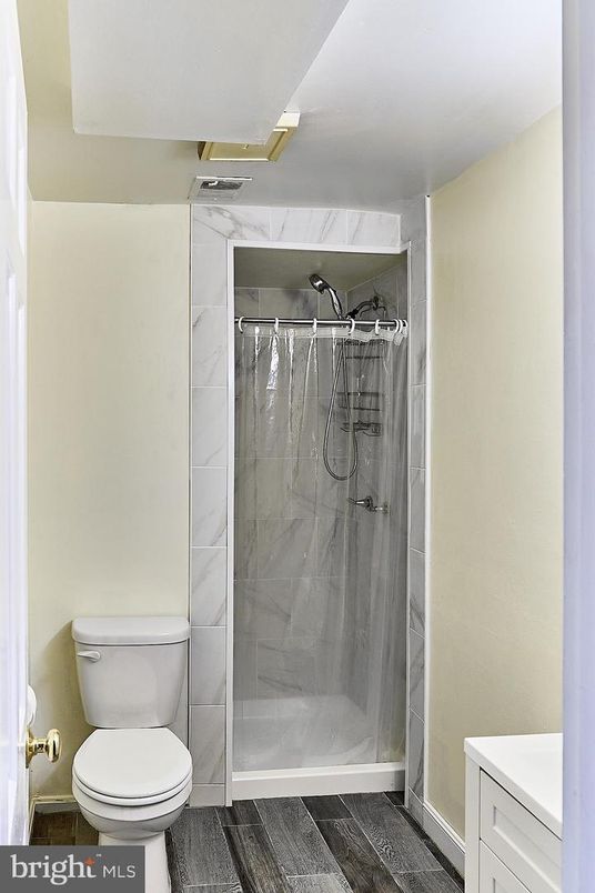 Bathroom, Glass Shower, Interior, Marble Walls, Wood Texture Flooring