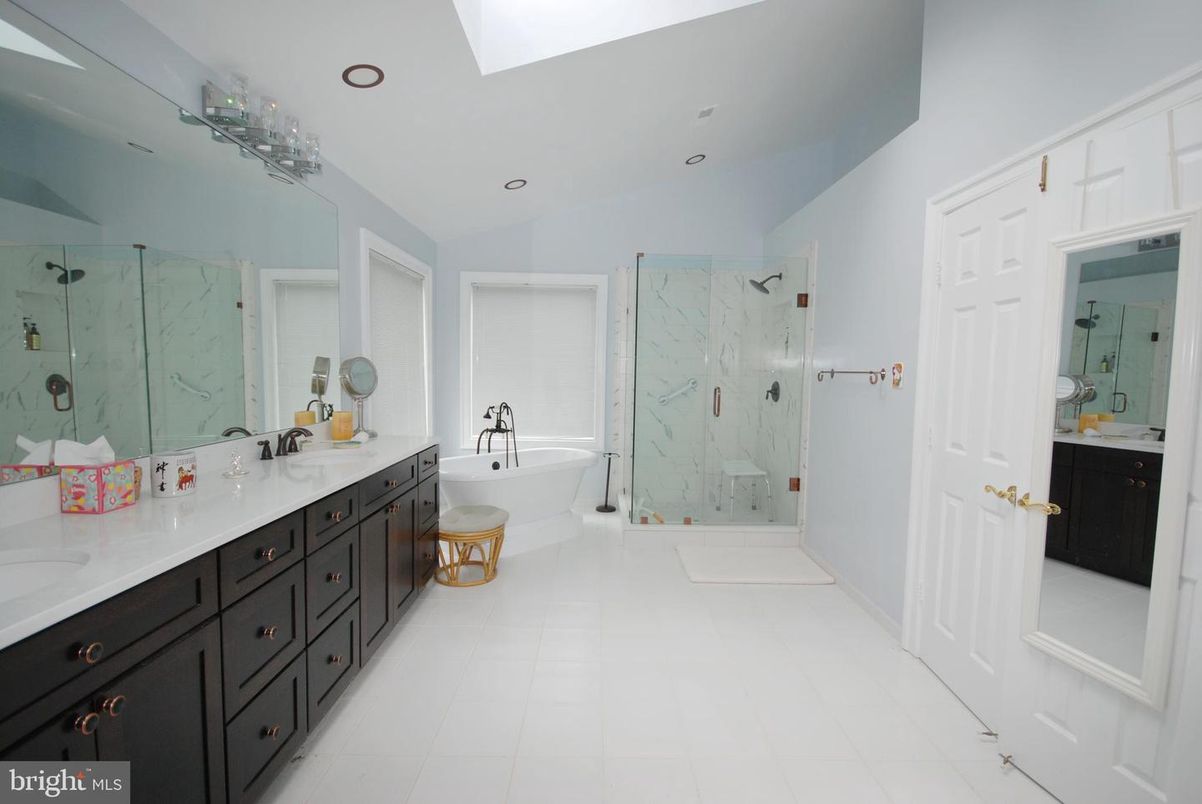 Bathroom, Dual Sink Vanities, Glass Shower, Interior, Marble Walls, Recessed Lighting