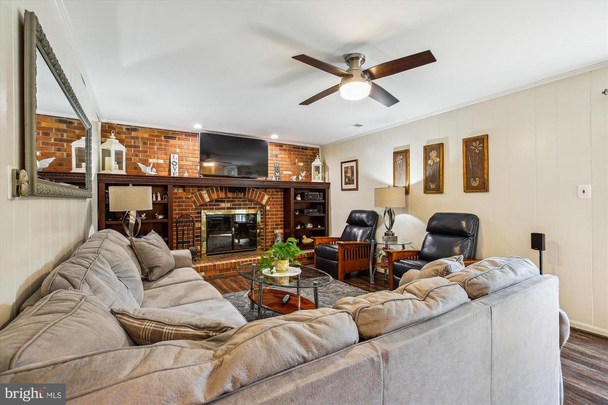 Fireplace, Interior, Living room, Recessed Lighting, Stone Walls, Wood Texture Flooring