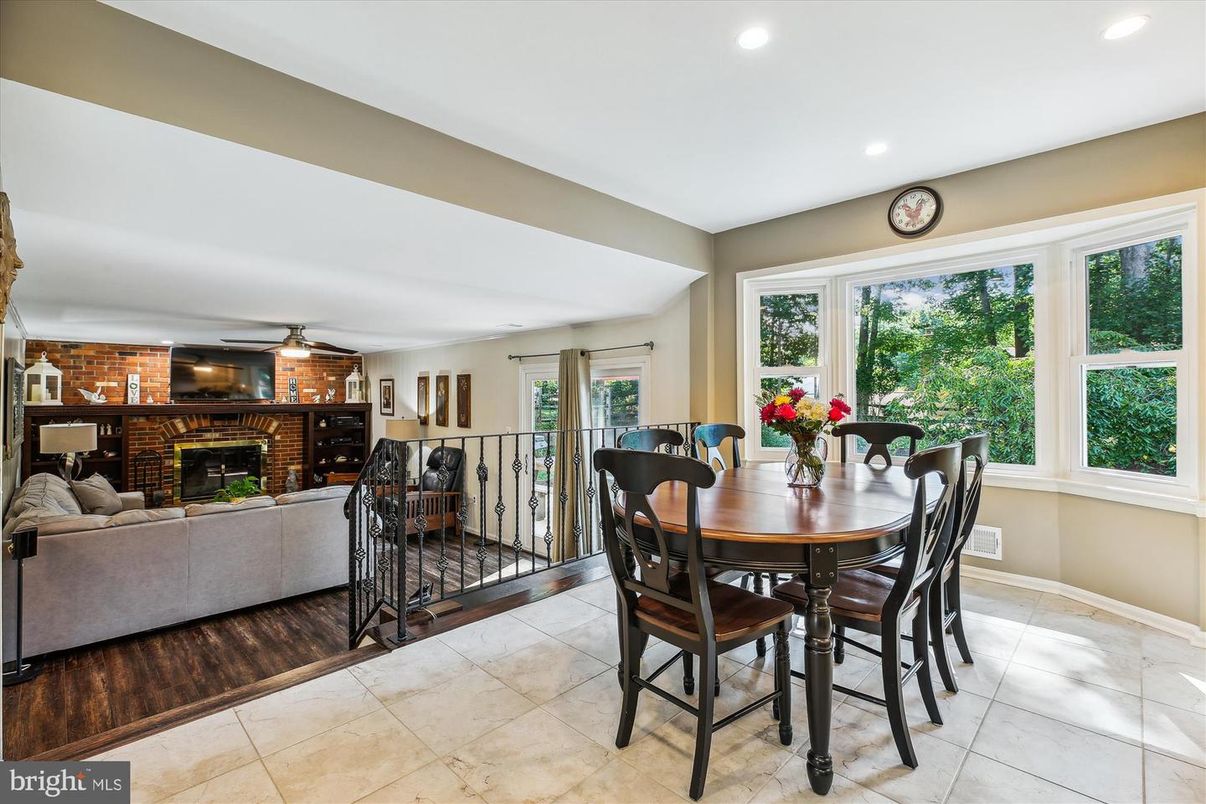 Dining room, Fireplace, Interior, Living room, Recessed Lighting, Stone Walls, Wood Texture Flooring