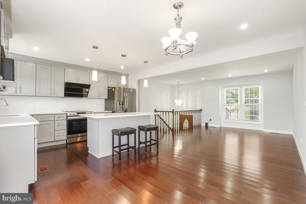 Chandelier, Interior, Kitchen, Pendant Lights, Recessed Lighting, Stainless Steel Appliances, Wood Texture Flooring