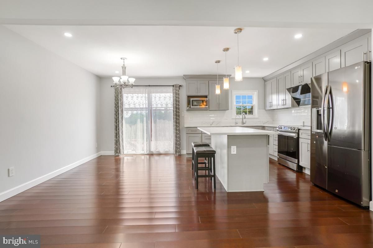 Chandelier, Interior, Kitchen, Pendant Lights, Recessed Lighting, Stainless Steel Appliances, Wood Texture Flooring