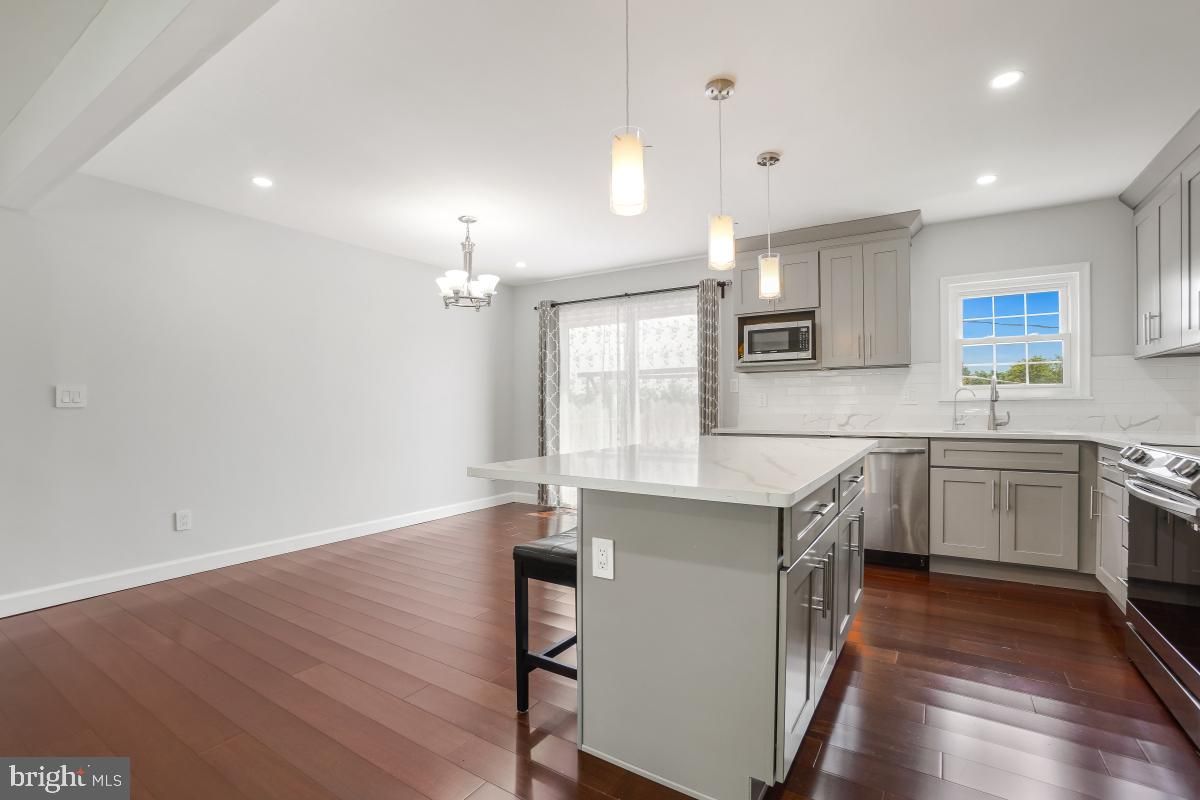 Chandelier, Interior, Kitchen, Pendant Lights, Recessed Lighting, Stainless Steel Appliances, Wood Texture Flooring