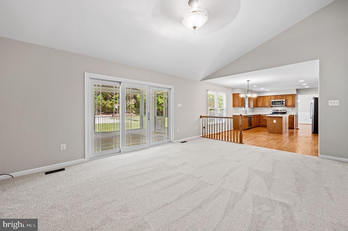 Empty room, Interior, Kitchen, Pendant Lights, Recessed Lighting, Stainless Steel Appliances, Wood Texture Flooring
