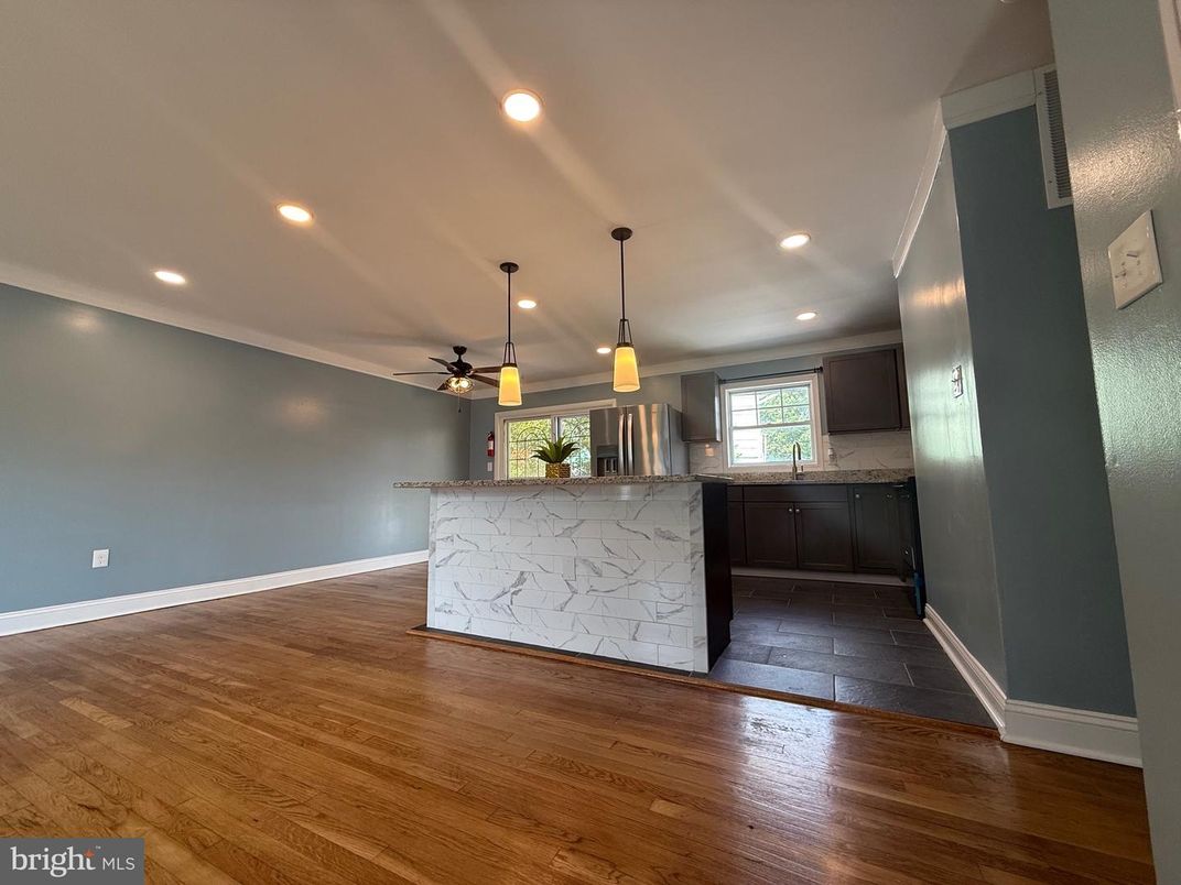 Interior, Kitchen, Marble Walls, Pendant Lights, Recessed Lighting, Wood Texture Flooring