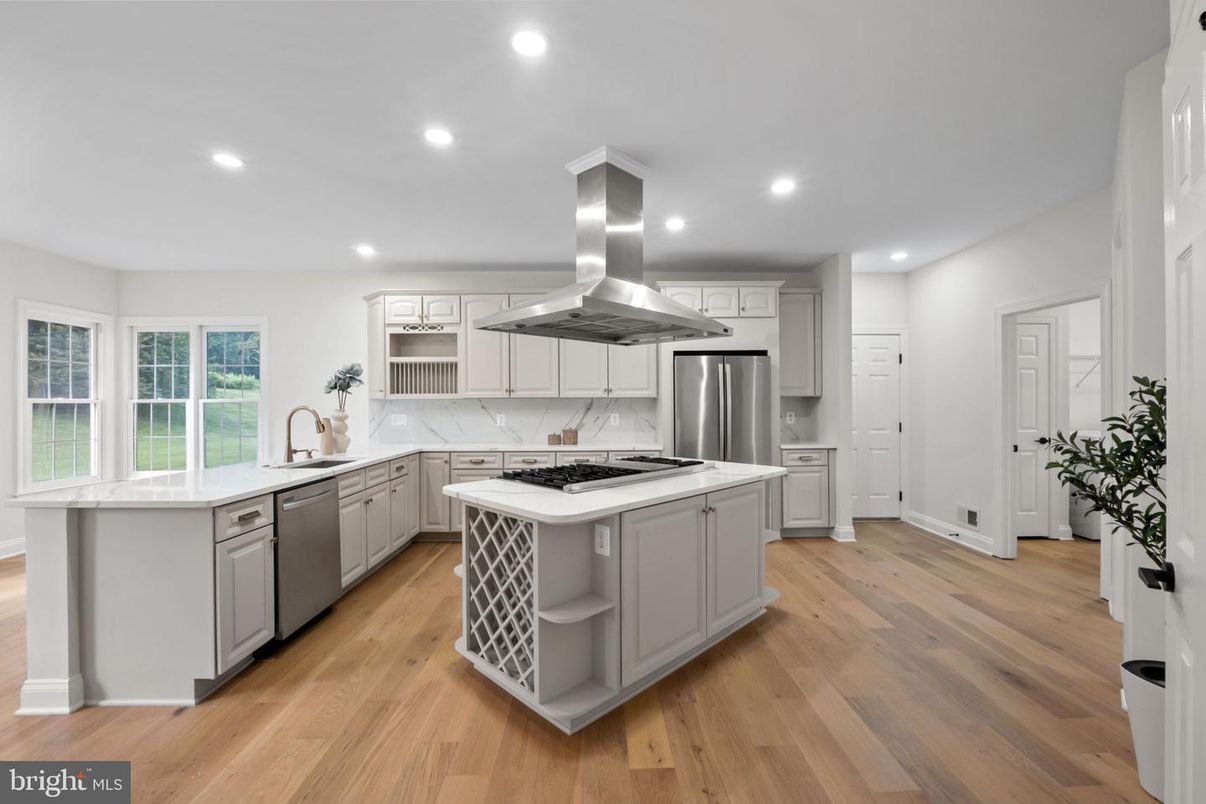 Interior, Kitchen, Marble Walls, Recessed Lighting, Stainless Steel Appliances, Wood Texture Flooring