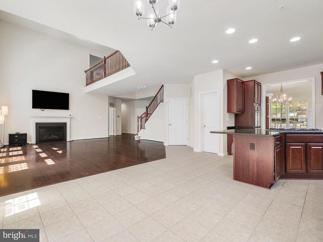 Chandelier, Fireplace, Interior, Kitchen, Recessed Lighting, Wood Texture Flooring