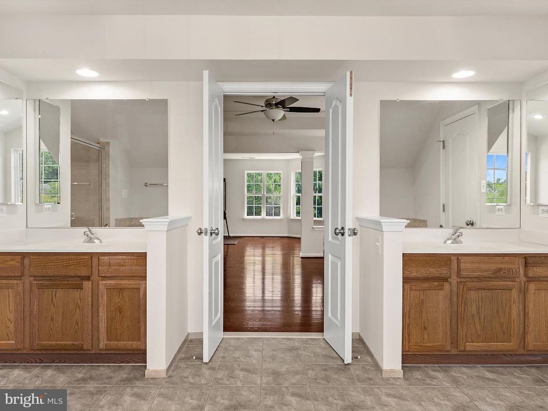 Bathroom, Dual Sink Vanities, Interior, Recessed Lighting, Wood Texture Flooring