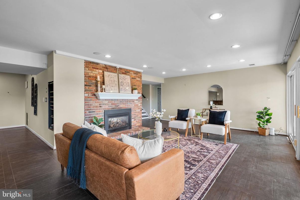 Fireplace, Interior, Living room, Recessed Lighting, Stone Walls, Wood Texture Flooring