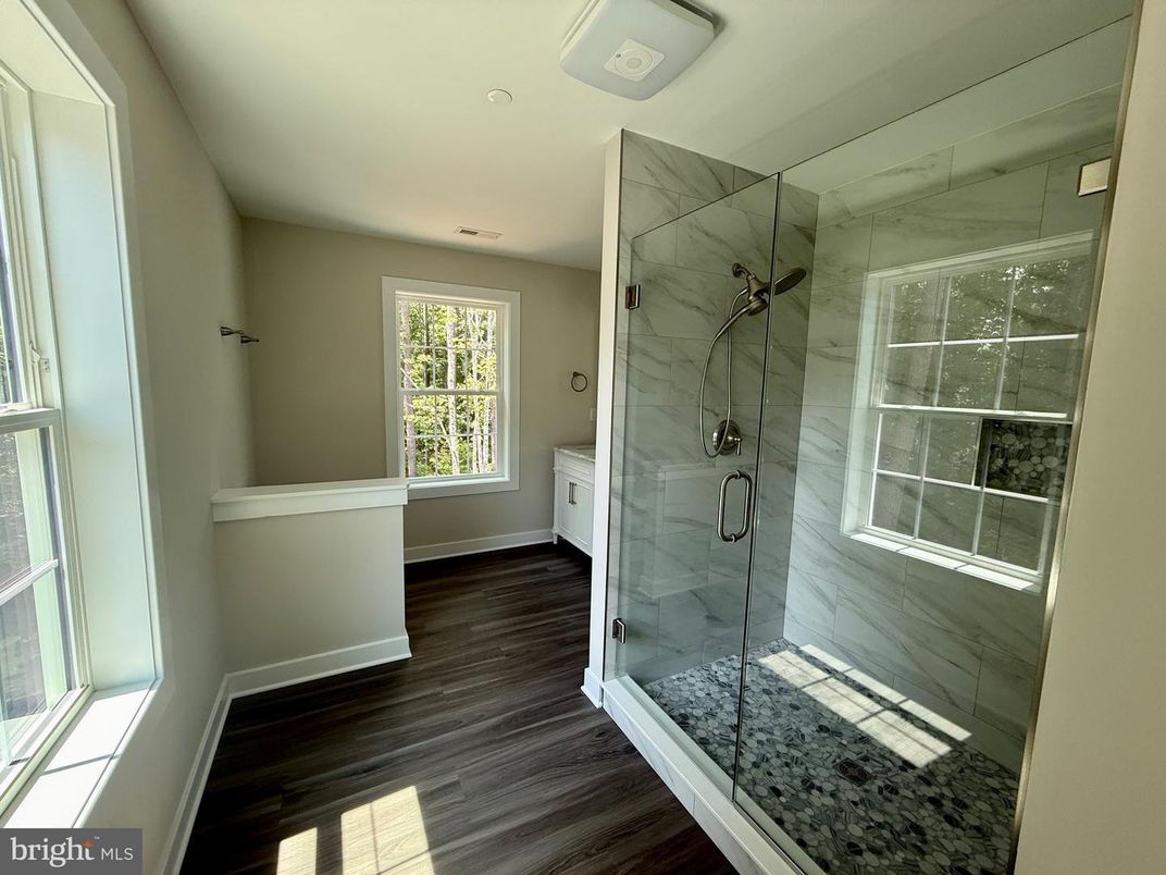 Bathroom, Glass Shower, Interior, Marble Walls, Recessed Lighting, Wood Texture Flooring
