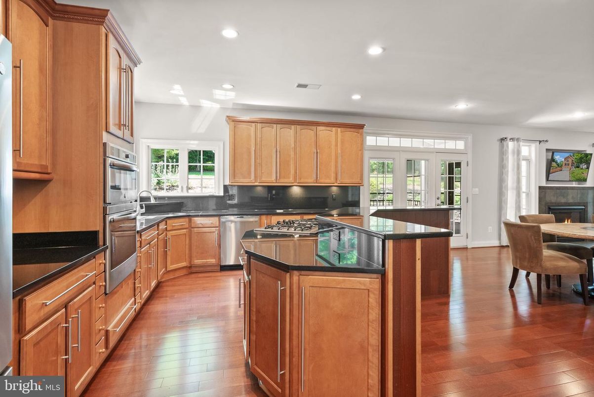 Dining room, Fireplace, Interior, Kitchen, Recessed Lighting, Stainless Steel Appliances, Wood Texture Flooring