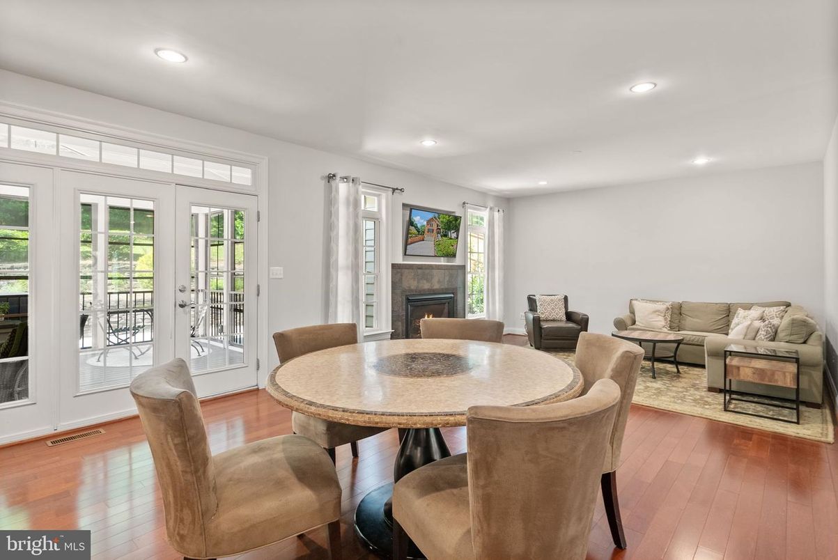 Dining room, Fireplace, Interior, Living room, Recessed Lighting, Wood Texture Flooring