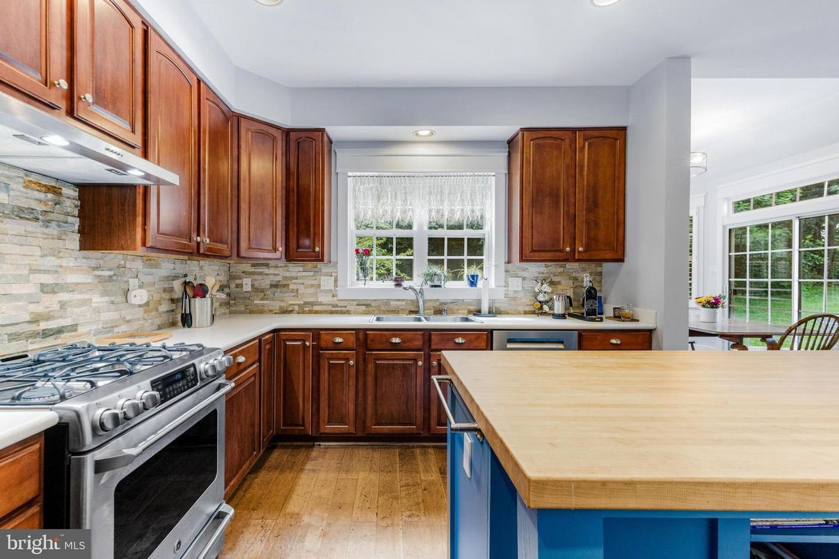 Interior, Kitchen, Recessed Lighting, Stainless Steel Appliances, Stone Walls, Wood Texture Flooring