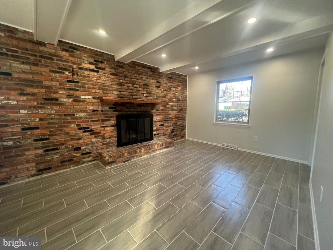 Empty room, Fireplace, Interior, Recessed Lighting, Stone Walls, Wood Texture Flooring