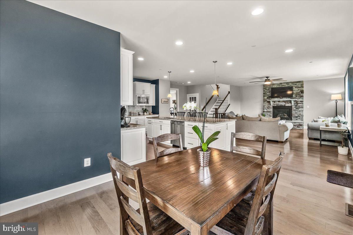Dining room, Fireplace, Interior, Kitchen, Living room, Pendant Lights, Recessed Lighting, Stone Walls, Wood Texture Flooring