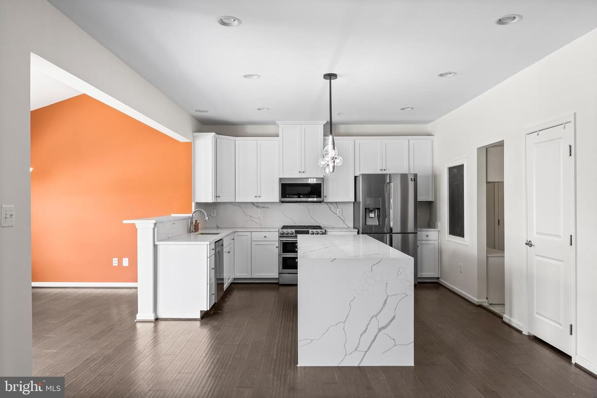 Interior, Kitchen, Marble Walls, Pendant Lights, Recessed Lighting, Stainless Steel Appliances, Wood Texture Flooring