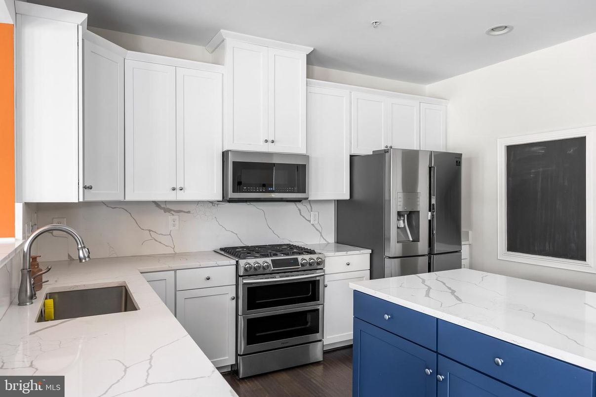 Interior, Kitchen, Marble Walls, Recessed Lighting, Stainless Steel Appliances, Wood Texture Flooring