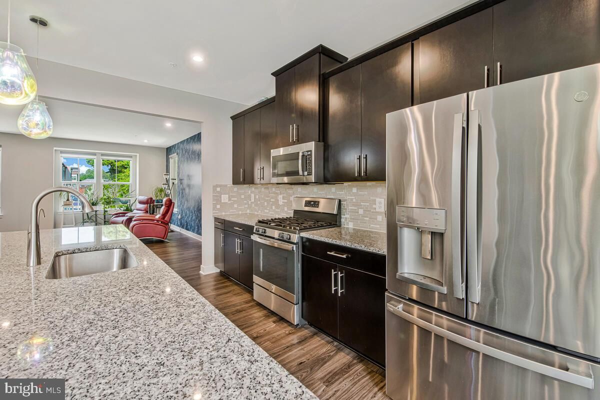 Dining room, Interior, Kitchen, Pendant Lights, Recessed Lighting, Stainless Steel Appliances, Wood Texture Flooring