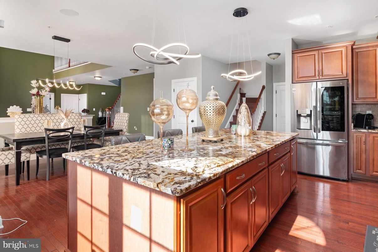 Dining room, Interior, Kitchen, Pendant Lights, Recessed Lighting, Stainless Steel Appliances, Wood Texture Flooring