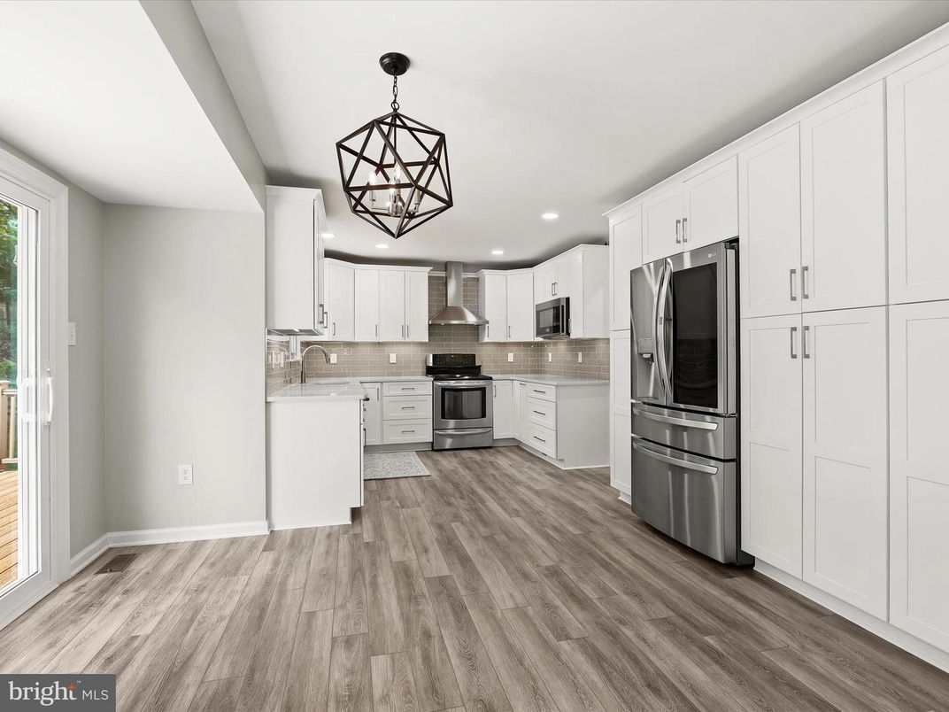 Chandelier, Interior, Kitchen, Pendant Lights, Recessed Lighting, Stainless Steel Appliances, Wood Texture Flooring