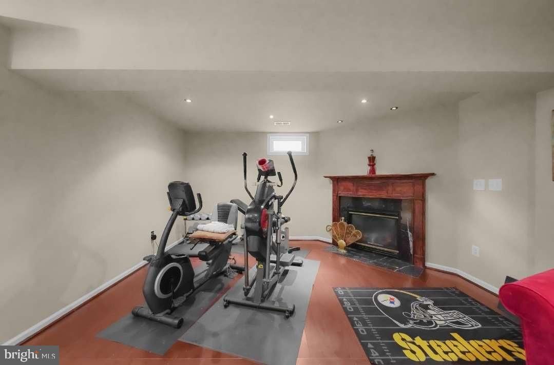 Fireplace, Fitness Equipment, Interior, Recessed Lighting, Wood Texture Flooring
