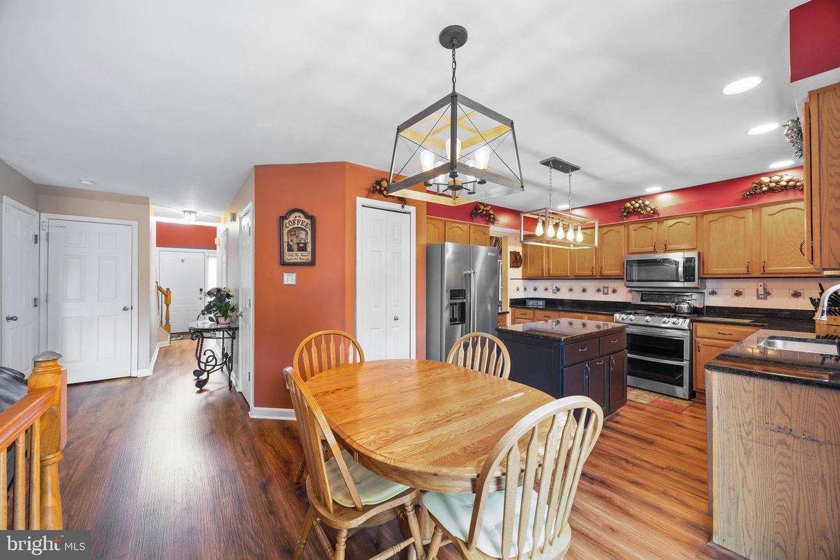 Dining room, Interior, Kitchen, Pendant Lights, Recessed Lighting, Stainless Steel Appliances, Wood Texture Flooring
