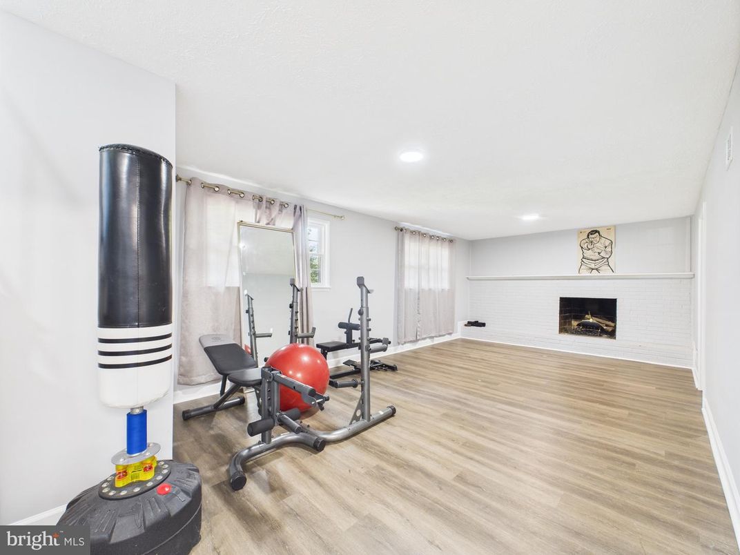 Fireplace, Fitness Equipment, Interior, Recessed Lighting, Wood Texture Flooring