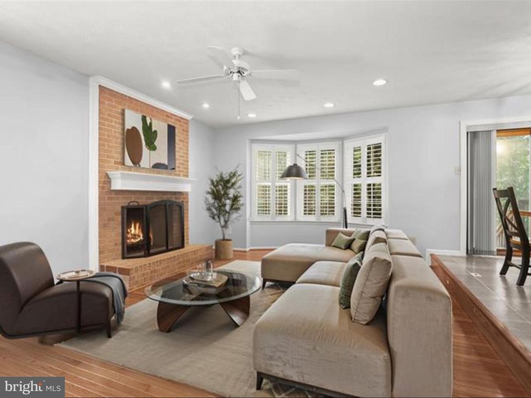 Fireplace, Interior, Living room, Recessed Lighting, Stone Walls, Wood Texture Flooring
