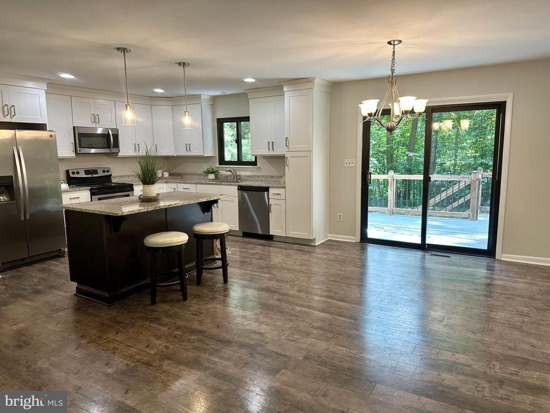 Chandelier, Interior, Kitchen, Pendant Lights, Recessed Lighting, Stainless Steel Appliances, Wood Texture Flooring