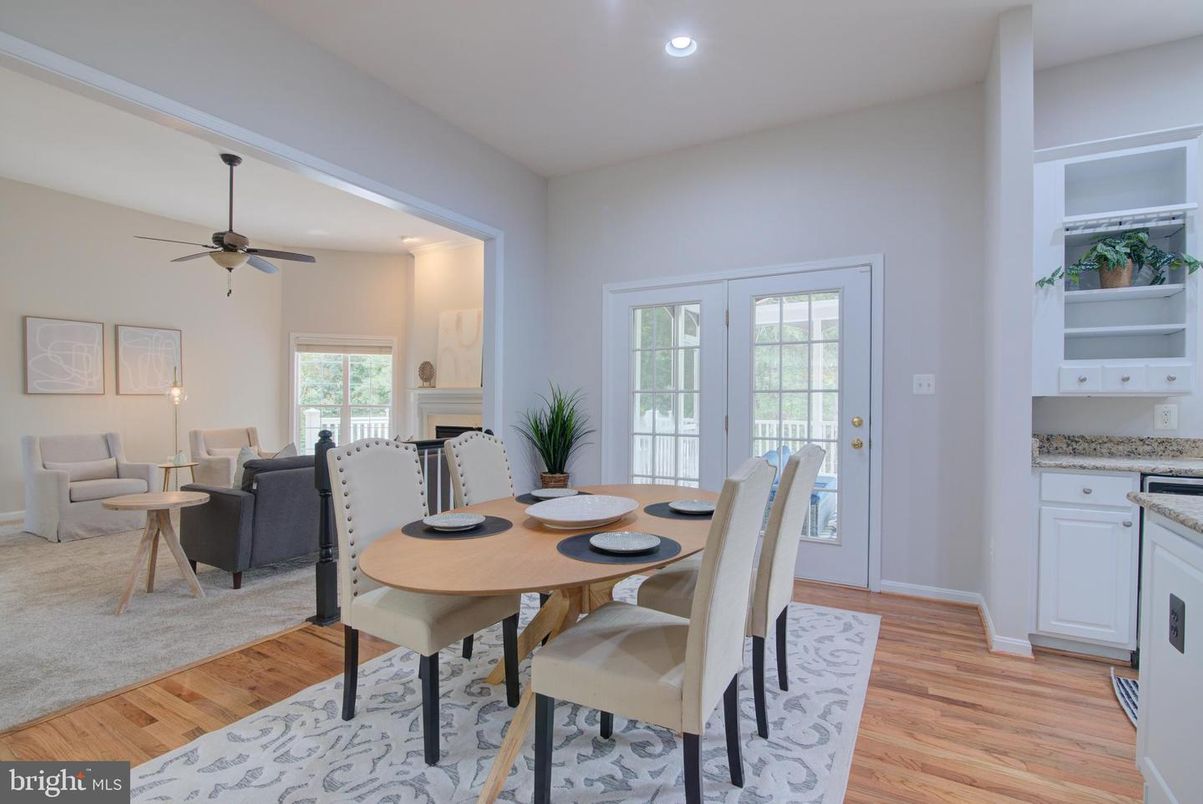Dining room, Fireplace, Interior, Living room, Recessed Lighting, Wood Texture Flooring