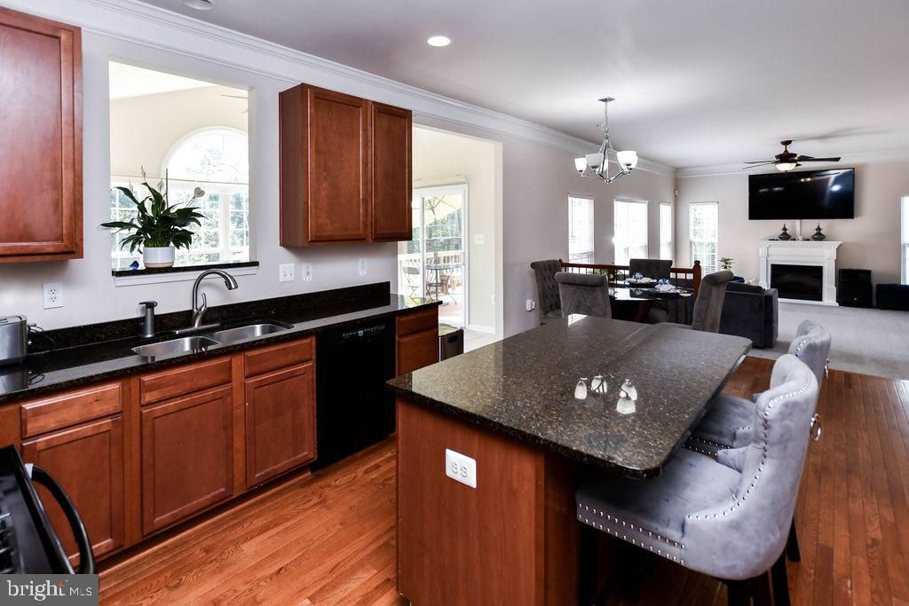 Chandelier, Dining room, Fireplace, Interior, Kitchen, Recessed Lighting, Wood Texture Flooring