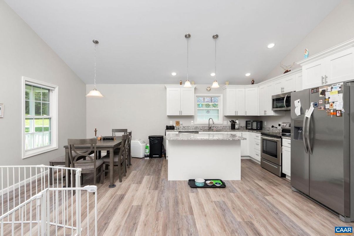 Dining room, Interior, Kitchen, Pendant Lights, Recessed Lighting, Stainless Steel Appliances, Wood Texture Flooring