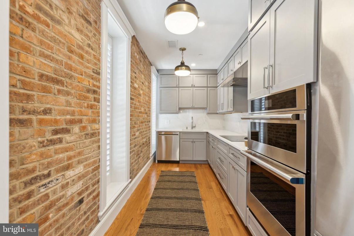 Interior, Kitchen, Pendant Lights, Stainless Steel Appliances, Stone Walls, Wood Texture Flooring