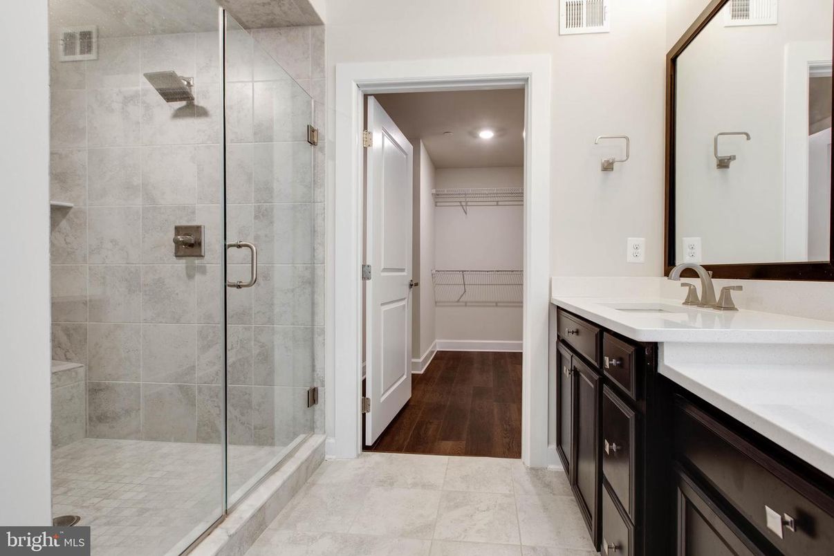 Bathroom, Dual Sink Vanities, Glass Shower, Interior, Recessed Lighting, Wood Texture Flooring