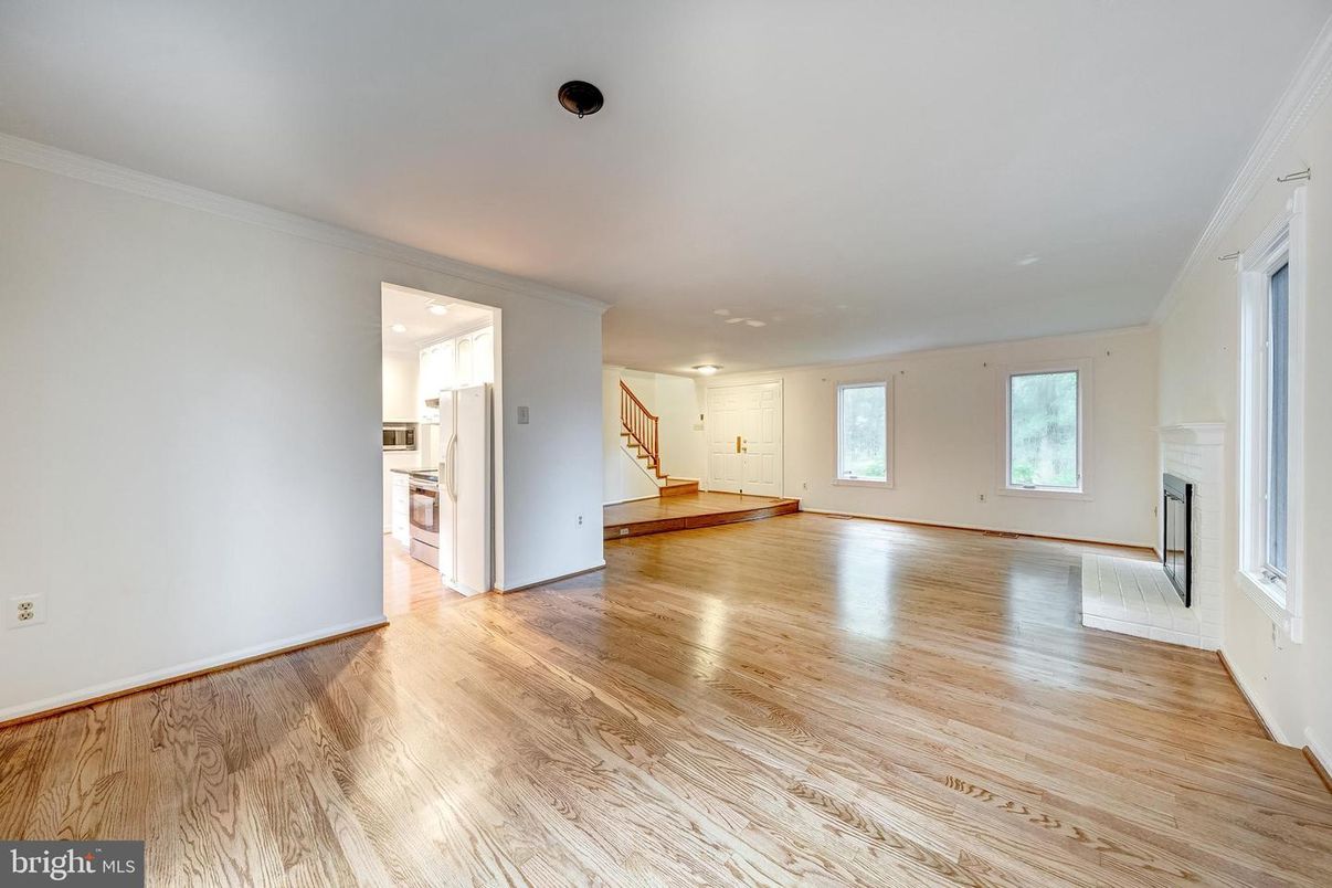 Empty room, Fireplace, Interior, Kitchen, Recessed Lighting, Wood Texture Flooring