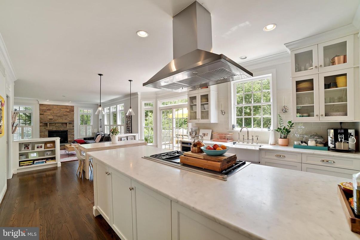 Dining room, Fireplace, Interior, Kitchen, Pendant Lights, Recessed Lighting, Stainless Steel Appliances, Wood Texture Flooring