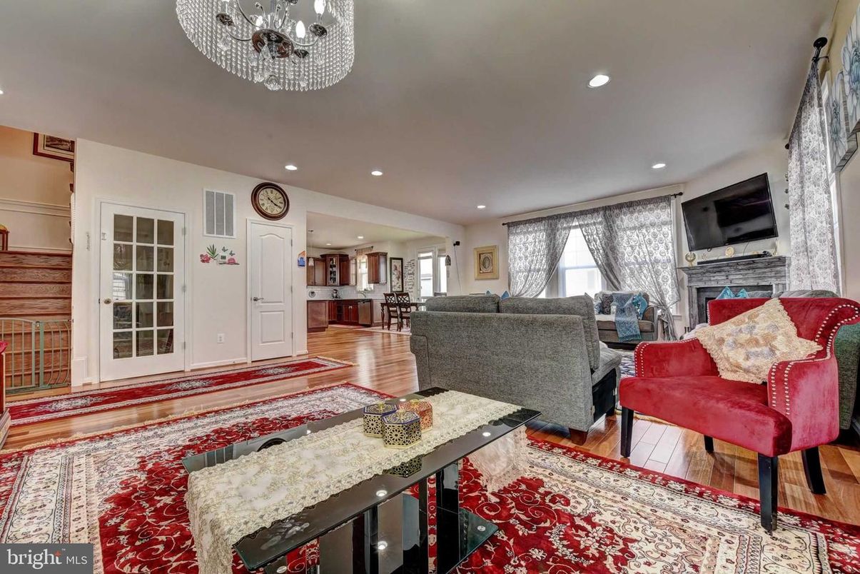 Chandelier, Fireplace, Interior, Living room, Recessed Lighting, Wood Texture Flooring